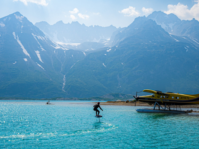 Helicopter over remote Alaska lake